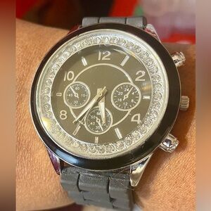 Silver Tone Watch w/Black Dial and Crystal Accent Bezel. Silicone Strap. 10 inch